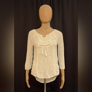 Cream blouse. Longer in the back. Size S